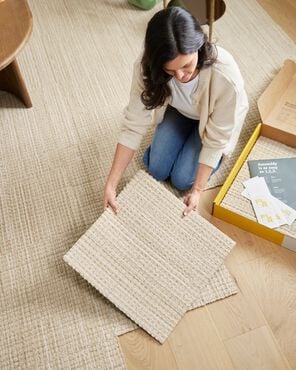 FLOR area rug being installed tile by tile