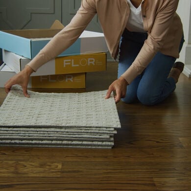 Person installing FLOR carpet tiles